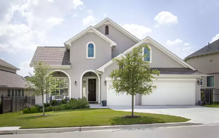 picture of a 1 1/2 story stucco home represneting a buyers home inspection home 